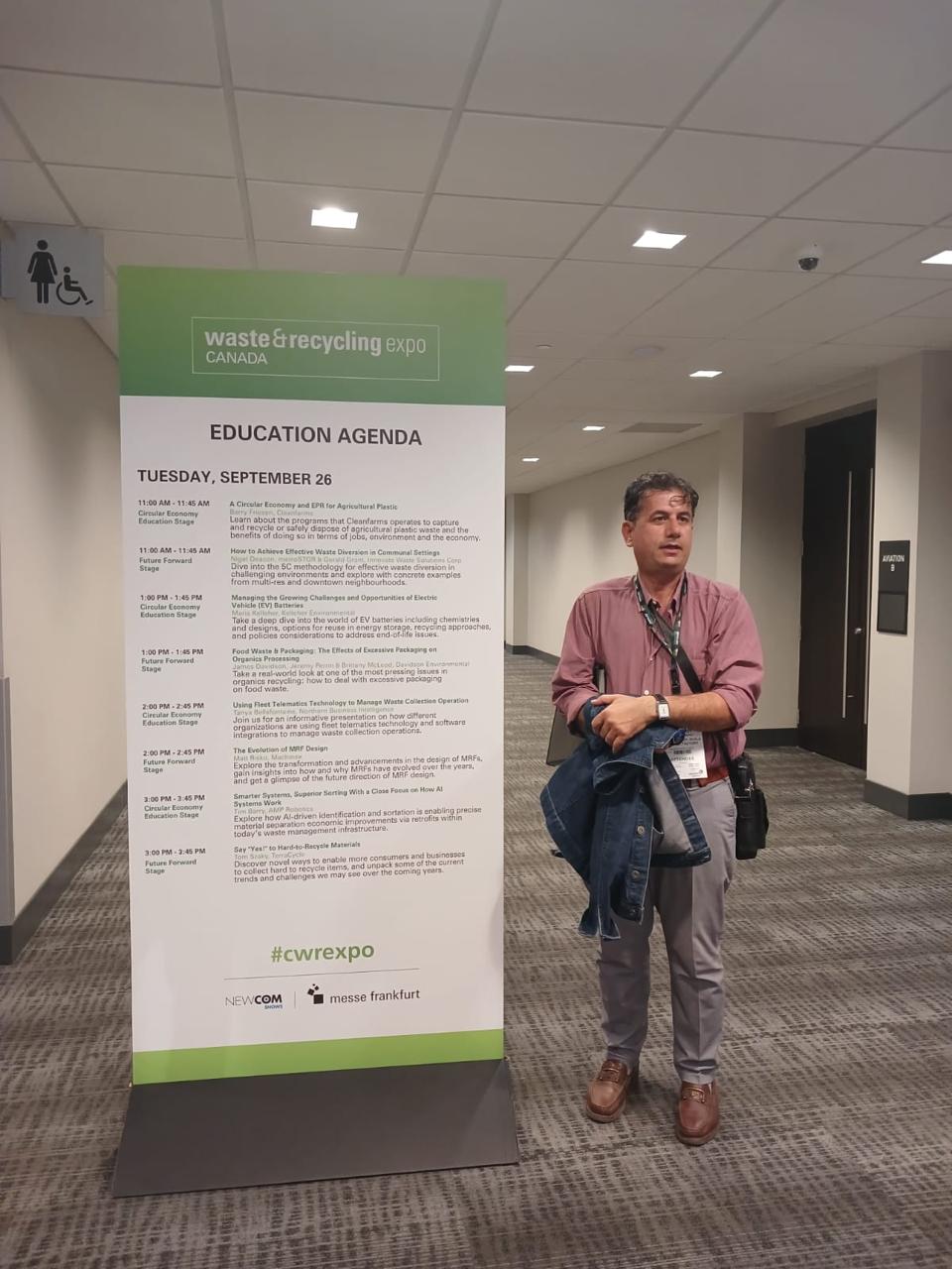 Attendee at Waste and Recycling Expo Canada beside the event agenda